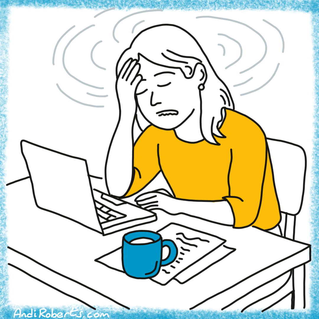 Leader at a desk, with hands on head showing burn out